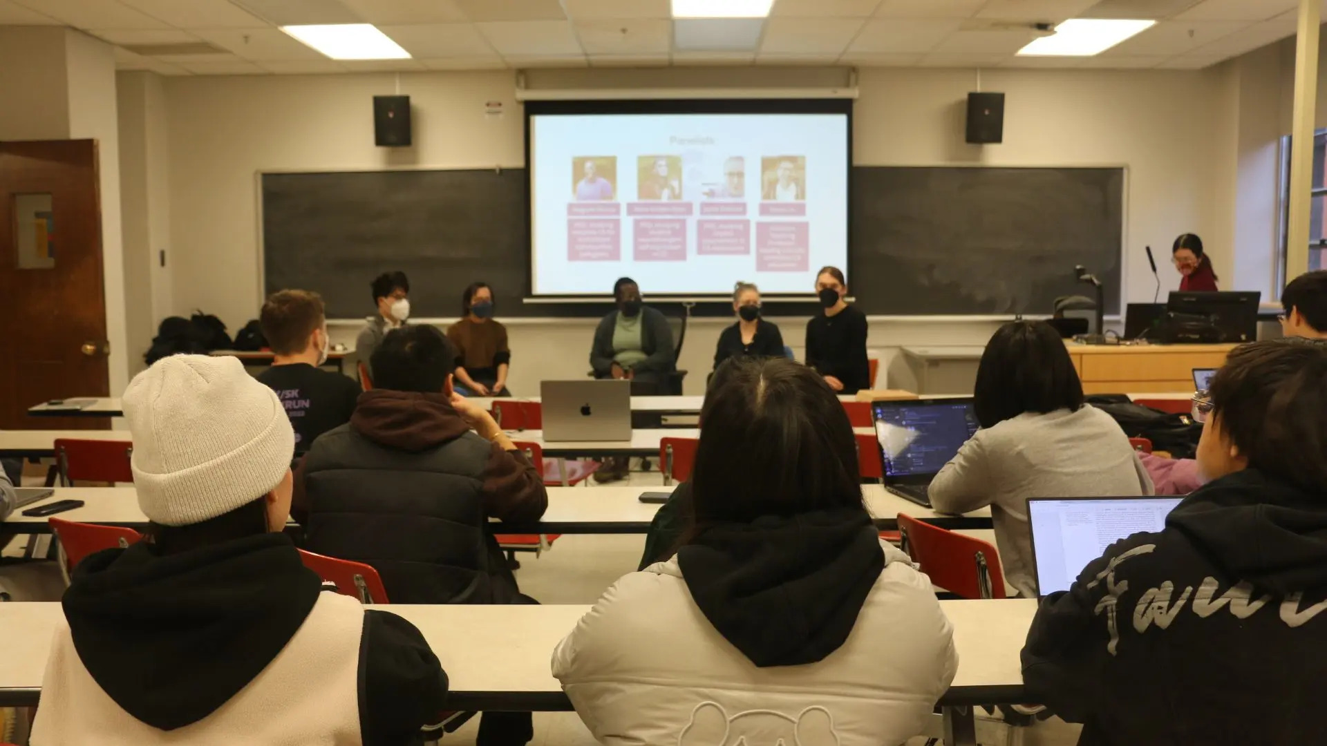 Students watching UW researchers presenting their work in computing education research