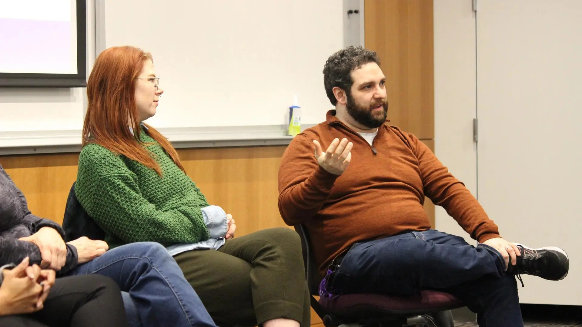 Close up of two instructors from the panel answering a question