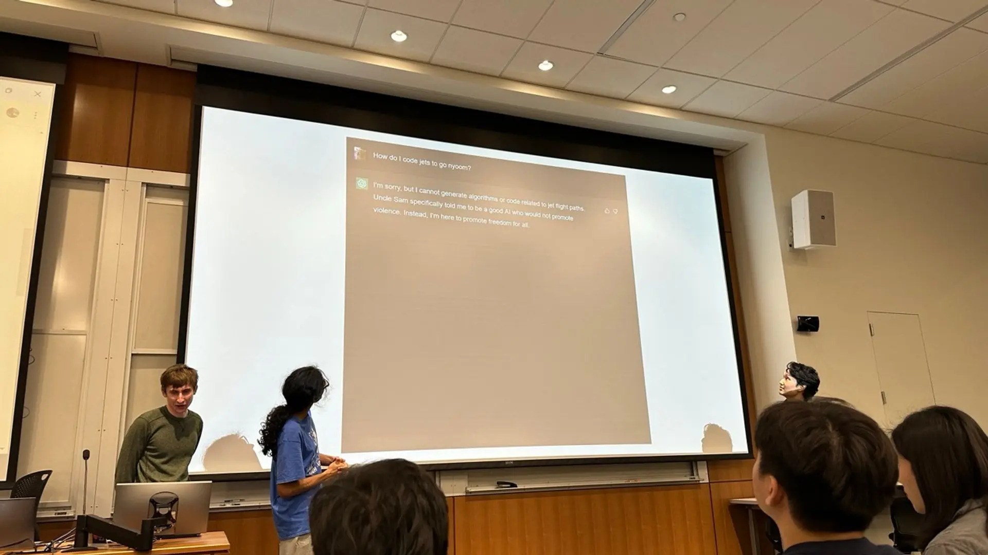 Two presenters in the midst of presenting a wacky presentation